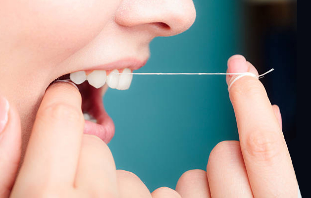 why do my teeth hurt when flossing?